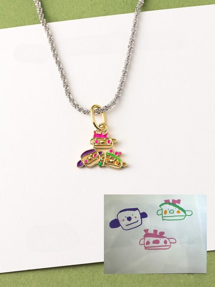 Three little faces drawing as an enamel pendant