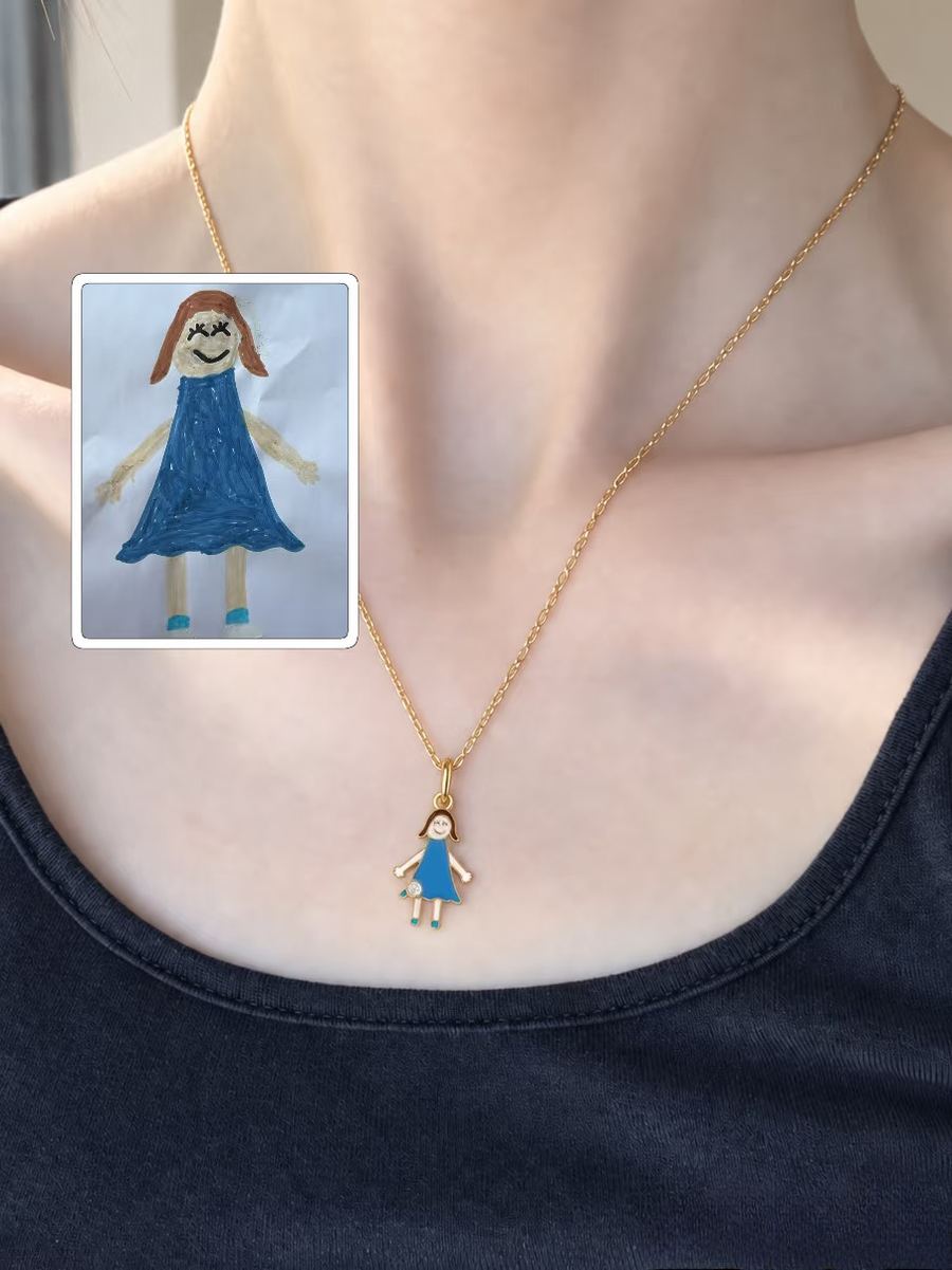 Girl in a blue dress as a small gold pendant, worn